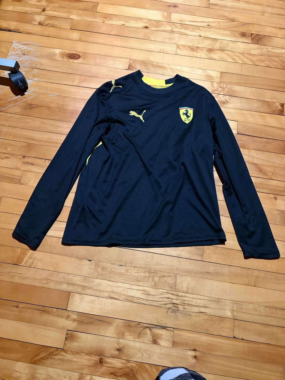 Puma Black Long-Sleeve Top with Yellow Accents & Ferrari Shield